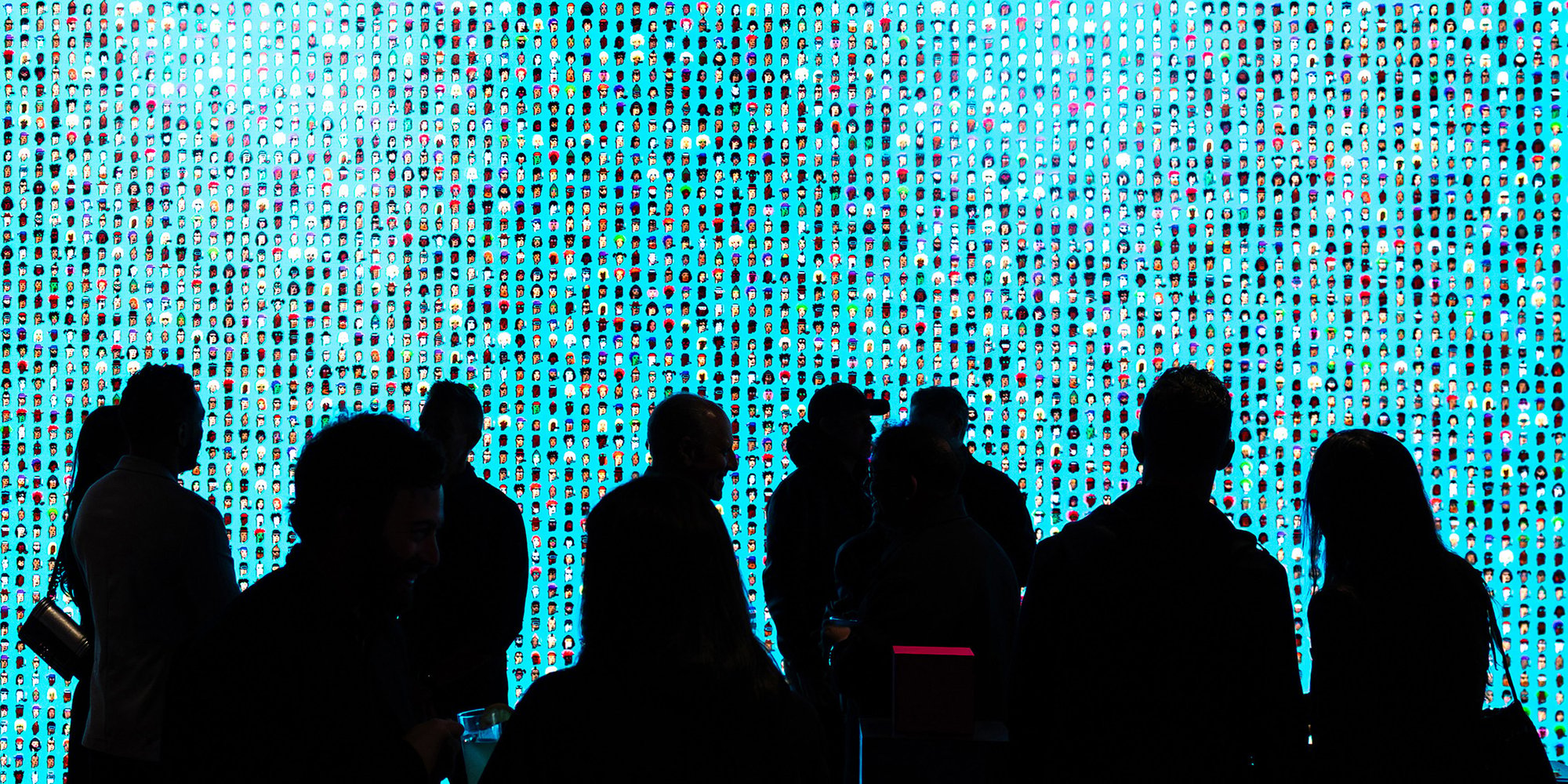 The opening night of “10,000”, NODE, Palo Alto. A section of the wall showing all 10,000 CryptoPunks. Photography by Felix Uribe