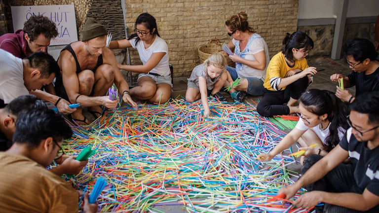Volunteers preparing the installation, The Parting of the Plastic Sea (2019), as part of #Strawpocalypse by Benjamin Von Wong. The artist and activist collaborated with Zero Waste Saigon and Starbucks Vietnam to gather a total of 168,000 drinking straws for the project. Image courtesy of the artist
